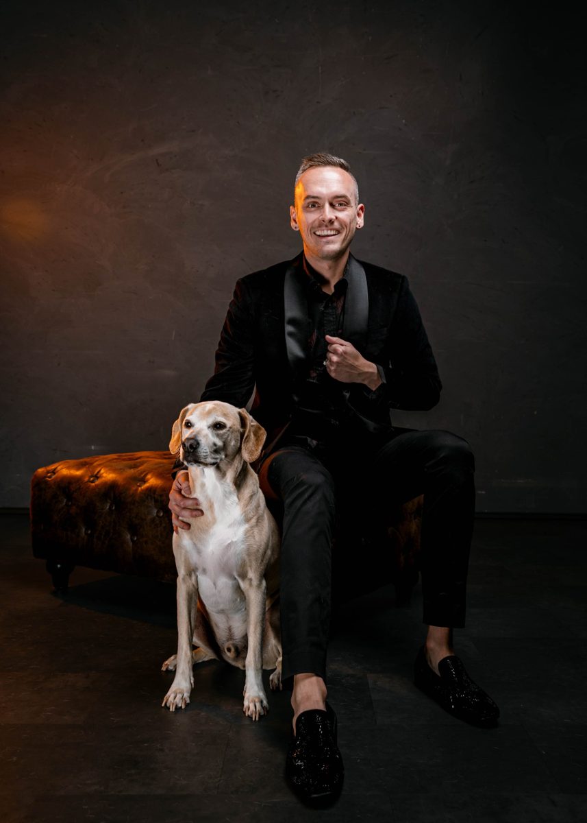 Tyler in a velvet blazer with his Lab mix