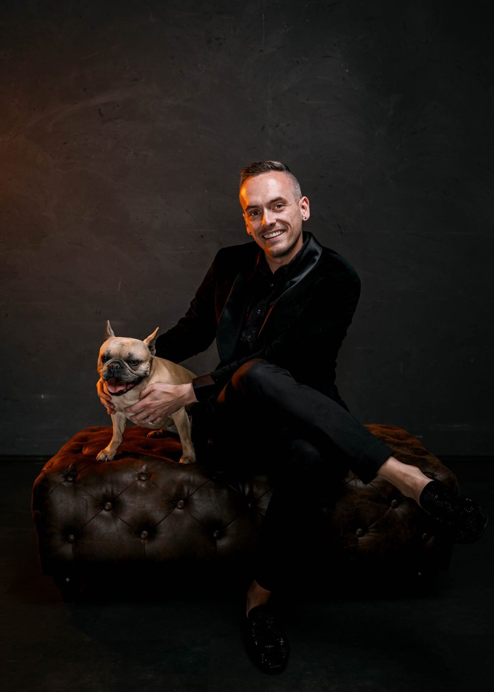 Tyler Gines with his fawn French bulldog