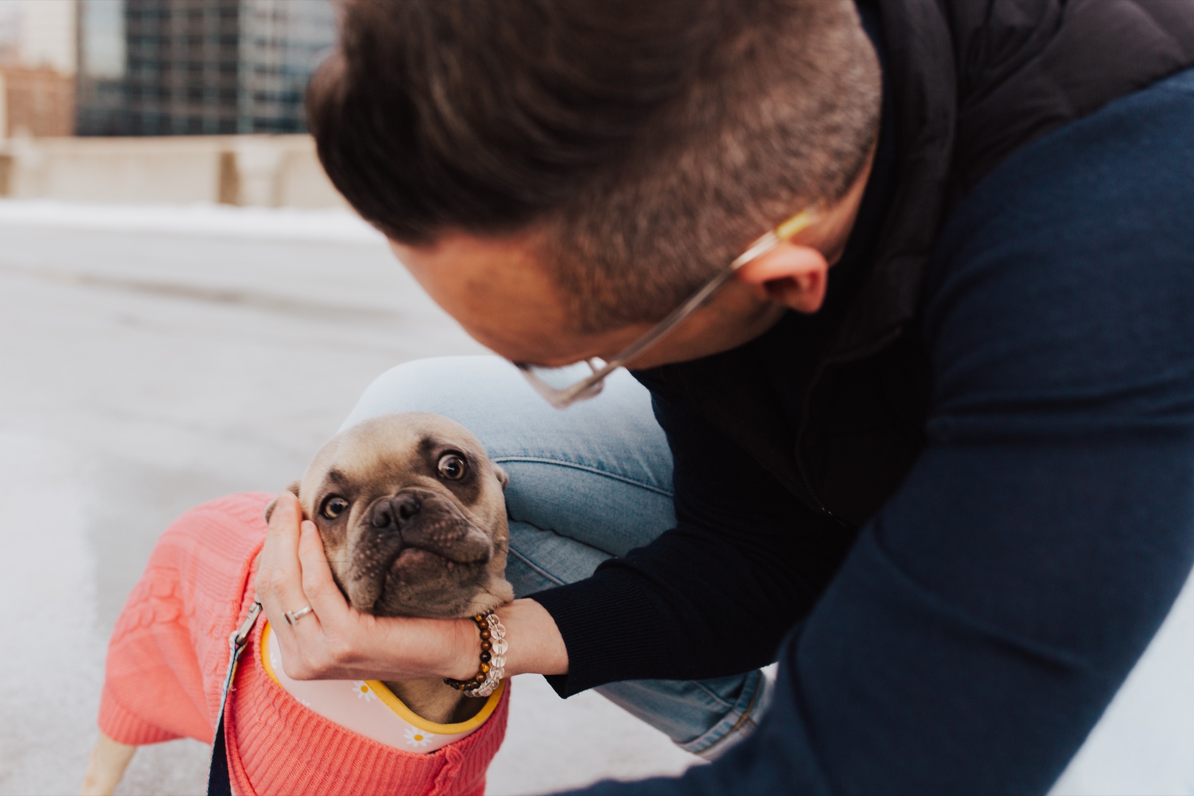Tyler Gines holding his dog’s face